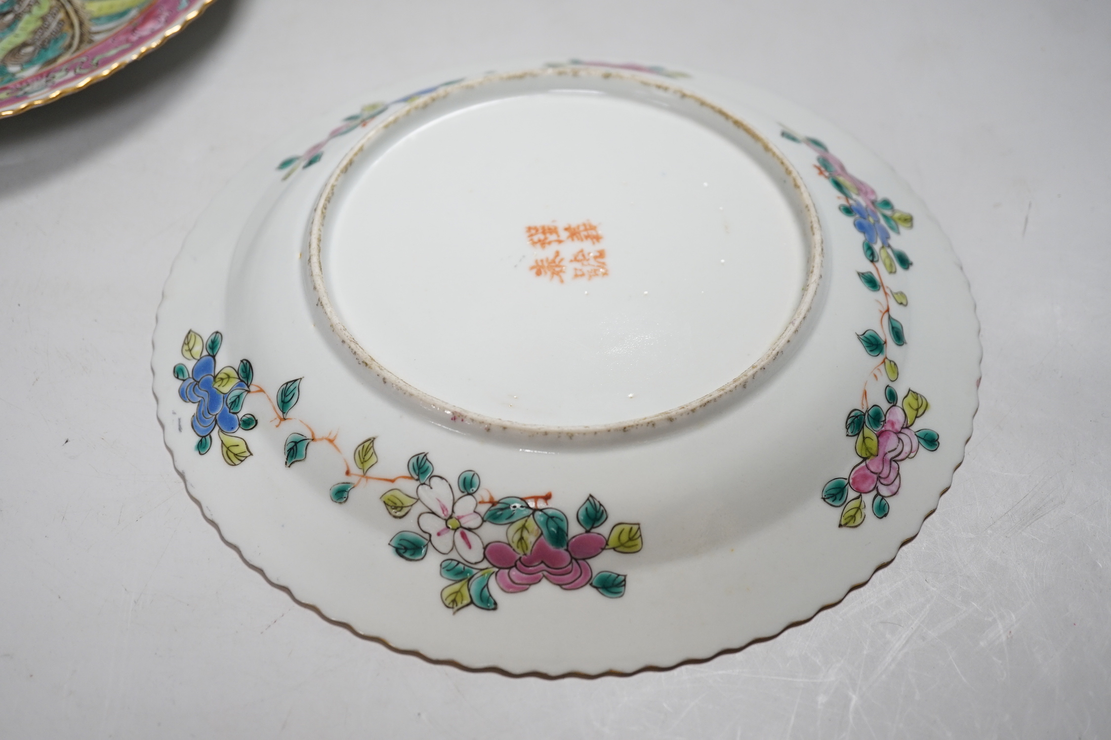 A pair of Chinese Straits famille rose plates for the Malaysian market, 23cm diameter